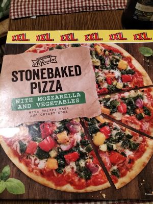 Stonebaked pizza with mozzarella and vegetables